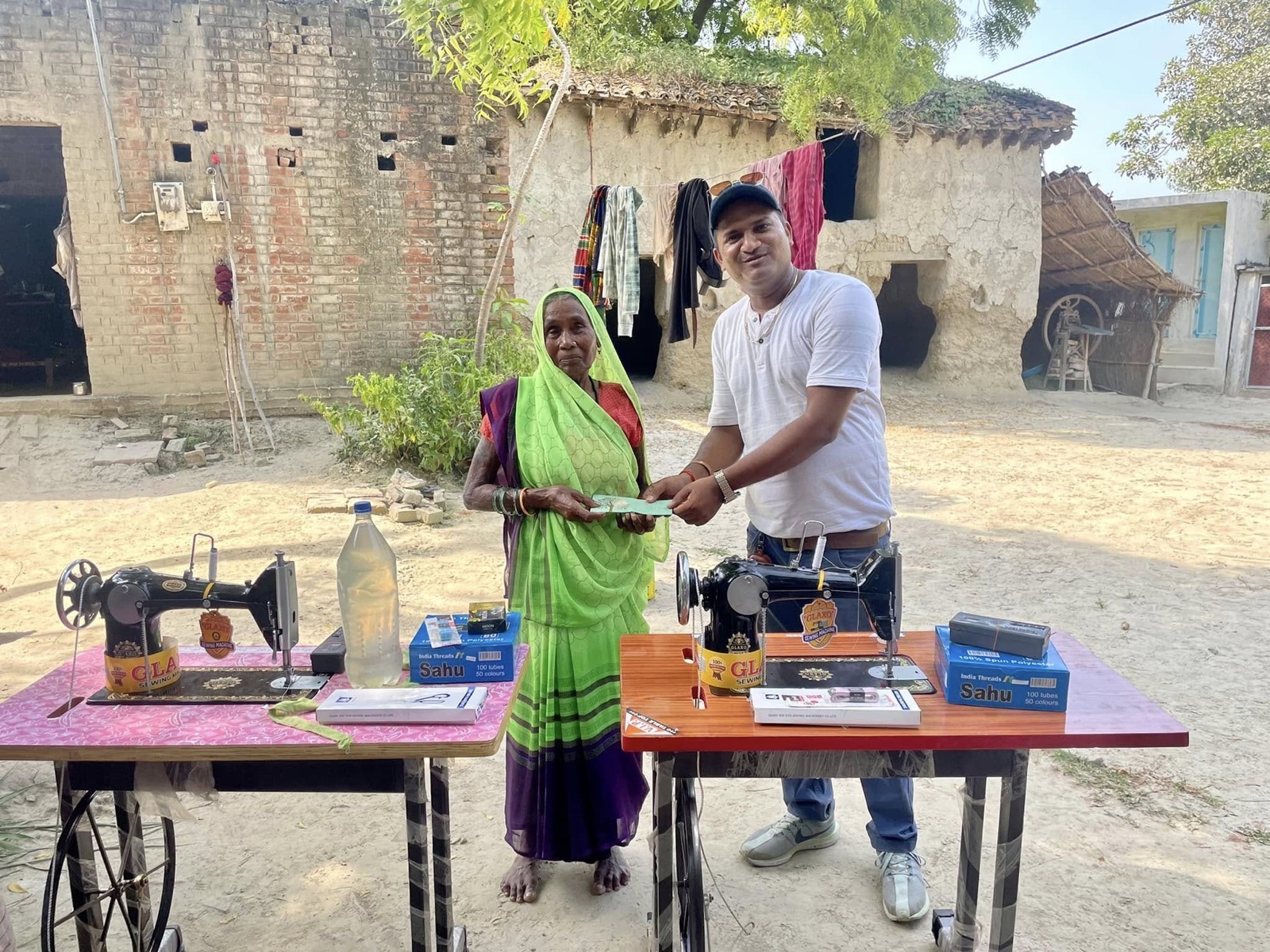 Women receiving sewing machines for livelihood